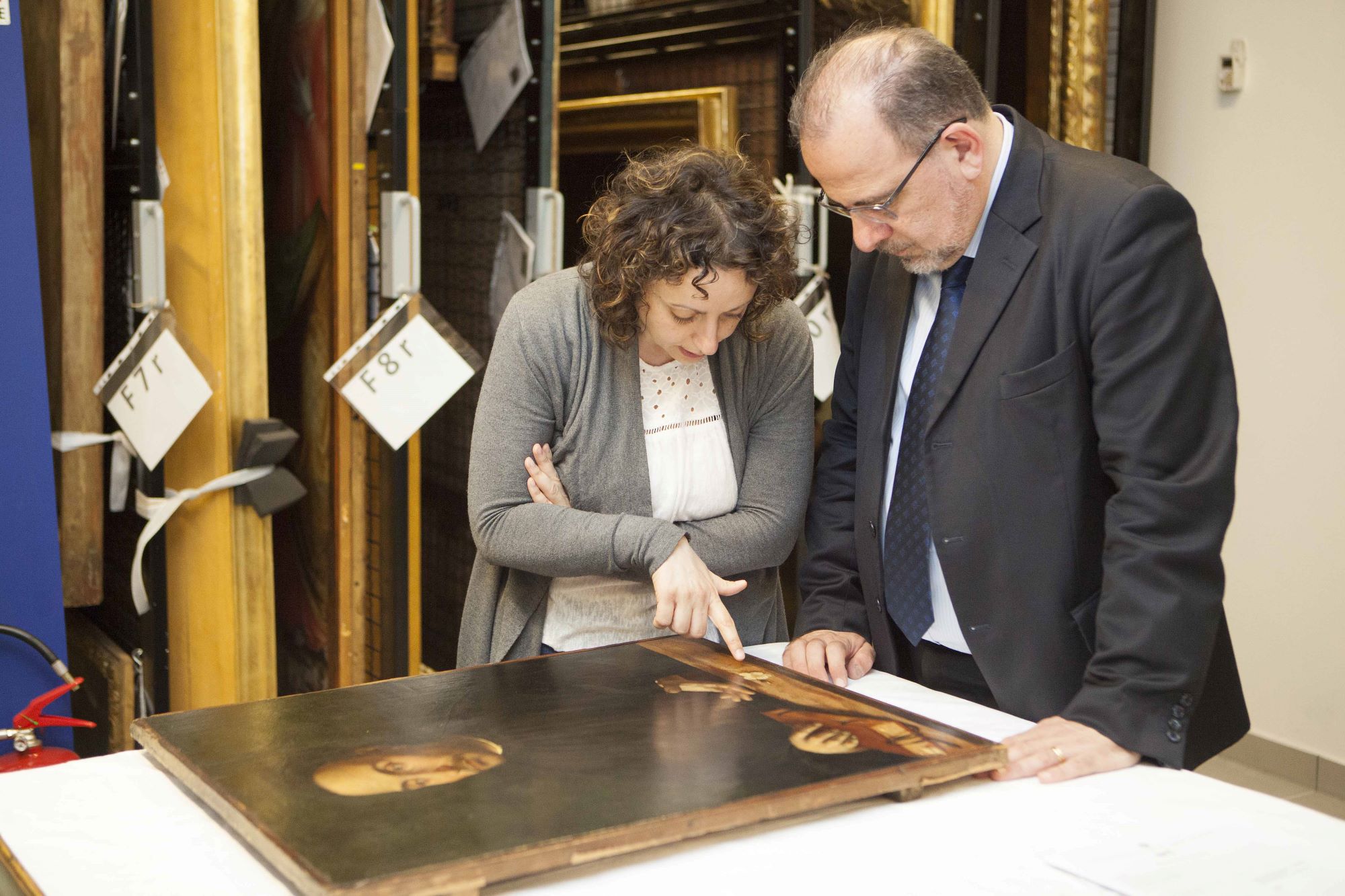 Man restoring an ancient piece of art with the guidance of a restaurator Luca Jahier, president of the European Economic and Social Committee at the Royal Museums, Turin © Image: Daniele Bottallo