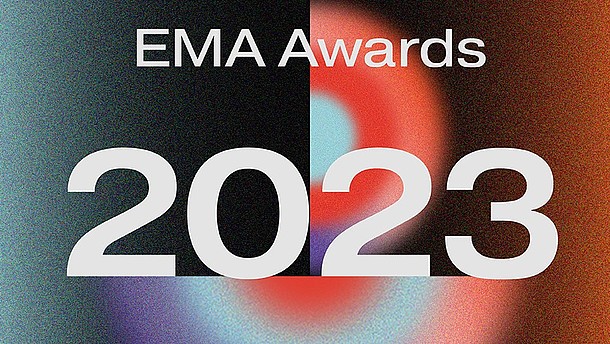  This graphic announces the EMA Awards 2023 in a large white font. The background consists of an abstract colourful image.