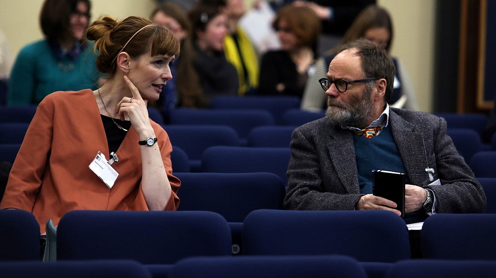 Photo of two people talking in a lecture hall.  © Irish Museums Association, Image: Jenny Matthews
