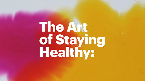  The abstract graphic consists of two blots in yellow and pink. The white lettering in the centre reads "The Art of Staying Healthy".