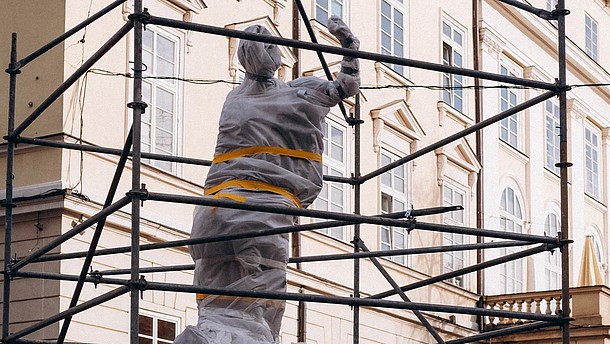  Statue wrapped in protective material.